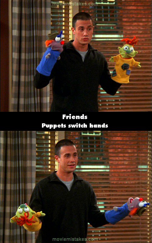 Ross and Rachel's Sandy picks up two puppets and puts them on each hand